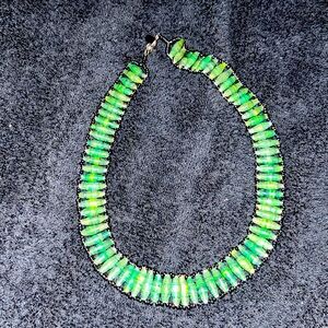 Marla Sage green choker necklace does have a signature green beaded design